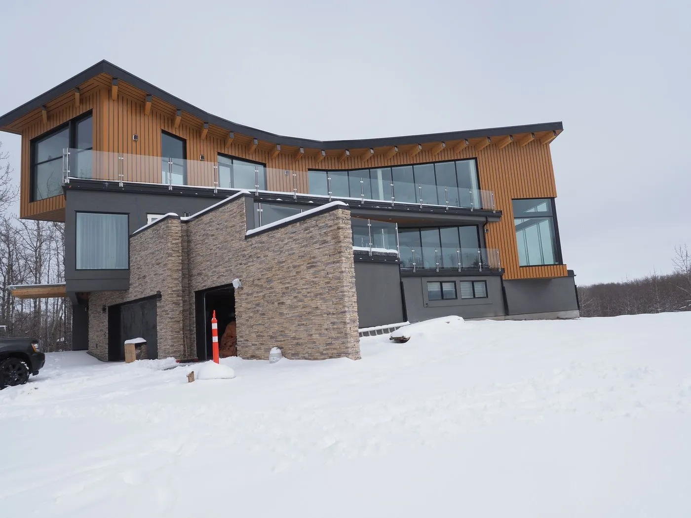 Completed home with cedar tower built under 1838 Project X supervision in Bearspaw, AB